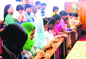 On the occasion of Easter, followers offer prayers at a church in Sector 18 on Sunday.