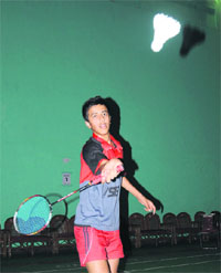 Abhishek Saini (left) on his way to win the U-17 title of the badminton tournament held at Sector 42, Chandigarh, on Sunday. 