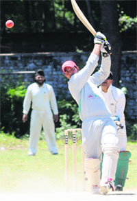 Rajbeer of Kudos XI hits a shot during a match against 