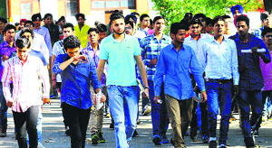 Students come out of an examination centre after appearing for the National Defence Academy examination at Government Model Senior Secondary School, Sector 10, in Chandigarh on Sunday.