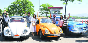 Participants of a vintage car rally at Sukhna Lake on Sunday. 