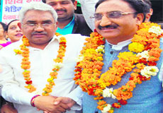 Ramesh Pokhriyal Nishank, BJP candidate from Haridwar, with MLA Madan Kaushik during an election meeting in Haridwar on Sunday.