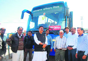 Mussoorie MLA Ganesh Joshi and other officials with the Volvo bus brought on a trial run on Sunday.