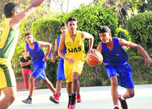 Players during a match in the Asian Challenge Cup All India Basketball Tournament for Boys played at Asian School in Dehradun on Sunday.