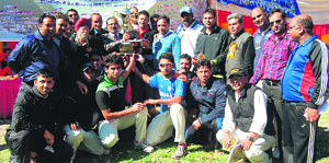 Members of Tanush Cricket Club that won the six-a-side tournament held at the Survey ground in Mussoorie on Sunday.