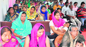 Devotees take part in a religious sermon on Easter at a church in Haridwar on Sunday.