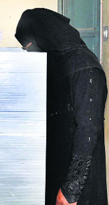 A woman casts her vote at a polling booth in Mewat. 