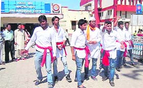 Theatre artistes perform a Nukkad Natak on the issue of elections near the city railway station in Jalandhar on Sunday
