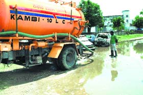 An MC vehicle being used to drain out water from Roshan Ground, the venue of the upcoming Modi rally, in Hoshiarpur