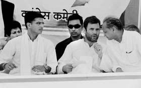 Rahul Gandhi with Congress candidate from Ajmer Sachin Pilot (L) and former Rajasthan Chief Minister Ashok Gehlot (R) during a rally in Karauli district on Sunday