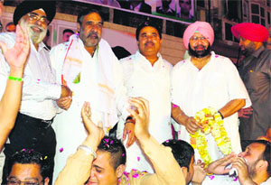 Captain Amarinder Singh and Union Commerce Minister Anand Sharma (second from left) take part in an election rally in Amritsar.