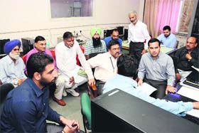 Officials during the final randomisation of the electronic voting machines (EVMs) in Bathinda on Monday