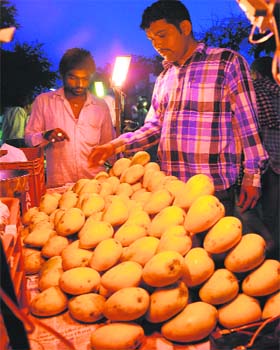 Mangoes being sold at a market in Chandigarh on Monday