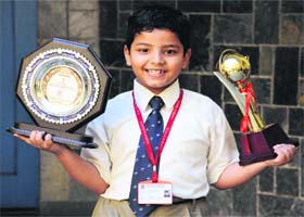 Youngest wrestler Guru Neelkanth Aher with his trophies at Saupins School in Sector 32, Chandigarh