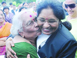 Chief Justice of the Delhi High Court Justice Gorla Rohini being greeted by her mother after the swearing-in ceremony in New Delhi on Monday.