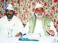 AAP candidate Rajan Sushant addresses a press conference in Dharamsala on Monday