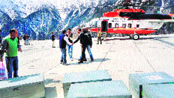 A helicopter with election-related materials at the Killar helipad in Chamba on Monday