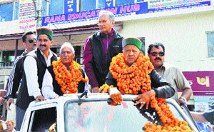 Chief Minister Virbhadra Singh with Vijai Singh Mankotia, Chander Kumar and others during an election rally in Dharamsala