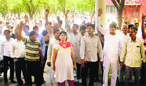 Villagers raise slogans against the police at Kosli town in Rewari district on Monday. 