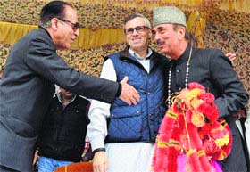 MOBILISING SUPPORT: Chief Minister Omar Abdullah, Union Health Minister Ghulam Nabi Azad and state Congress chief Saifuddin Soz during an election rally at Verinag in Anantnag district on Monday