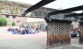 Students study in the open at a roofless school in Field Ganj, Ludhiana.