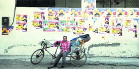 Party posters dot a wall in Ludhiana.