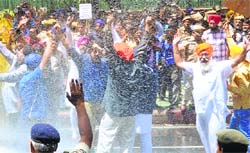 The Delhi Police use water cannons to disperse Shiromani Akali Dal activists protesting against a statement of Congress leader Amarinder Singh, in New Delhi on Monday.