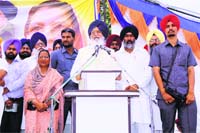 Chief Minister Parkash Singh Badal and Paramjit Kaur Gulshan in Kotkapura on Monday. Tribune photo 