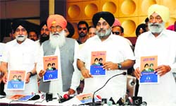 Sukhbir Badal (centre) releases party manifesto in Bathinda on Monday. Also in the picture are SS Dhindsa (left) and BS Bhunder, MPs. Tribune photo: Malkiat Singh 