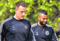 Chelseas John Terry and Ashley Cole arrive for a training session in Surrey on Monday. Chelsea will play Atletico Madrid in their Champions League semifinal first leg in Madrid on Tuesday. REUTERS