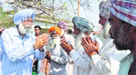 AAP candidate HS Phoolka greets residents of Mullanpur Dakha area in Ludhiana.