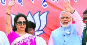 BJPs Narendra Modi with party candidate Hema Malini in Mathura on Monday.