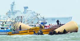 South Korean rescuers look for passengers believed to have been trapped in the sunken ferry in the waters off the southern coast near Jindo on Monday.