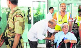 Relatives and family members receive passengers of the Malaysian Airline MH 192, which was rescheduled due to a problem in landing gear, in Bangalore on Monday.