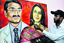 City-based artist Rubal paints a picture of film actress Rani Mukherjee with her husband Aditya Chopra on Tuesday