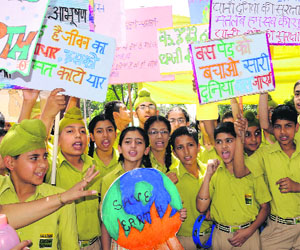 Students of Gian Jyoti School hold an awareness rally as part of the World Earth Day celebrations at the Deputy Commissioners office in Phase I, Mohali, on Tuesday.