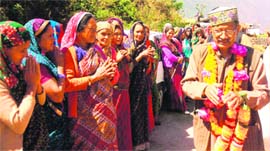 BC Khanduri, BJP candidate from the Pauri Garhwal constituency, seek votes of women at Kumeda in Pauri district on Tuesday.