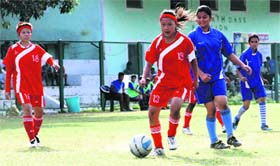 Players vie for the ball in a match in the Inter School Girls Football Tournament played at Pavilion Ground in Dehradun on Tuesday.