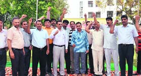 Members of the Haryana College Teachers Association protest on the Kuruksehtra University campus on Tuesday
