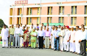Staff of CSSRI and NDRI with 21 farmers from four states honoured for unique practices in agriculture in Karnal on Tuesday