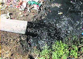 Chemically polluted water being released in the open area by an industrial unit near Kundli village in Sonepat district