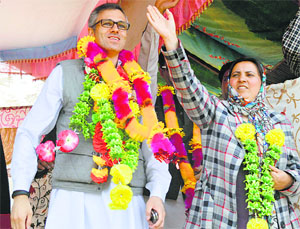Chief Minister Omar Abdullah with Social Welfare Minister Sakina Itoo during an election rally in Kulgam district on Tuesday.