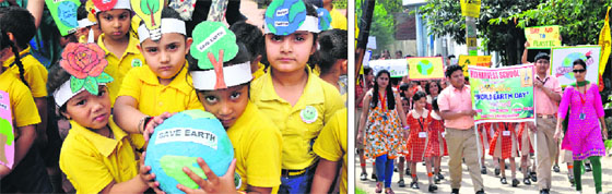 Students of Mothers Pride and Joy Pre-School; and (right) Rich Harvest School participate in awareness rallies during the celebration of Earth Day in Jammu.