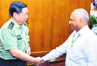 Lt Gen Qi Jianguo, Dy Chief of General Staff (Operations), PLA China, with Defence Secretary RK Mathur in New Delhi on Tuesday. PTI