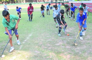Junior hockey players practise at the Hockey Stadium, Sector 18, in Chandigarh on Wednesday.