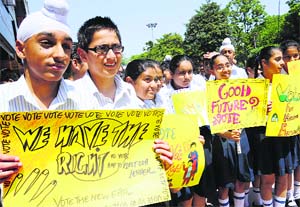 Students of The Millennium School hold a voter awareness rally at Phase VII, Mohali, on Wednesday. 