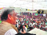 Former Chief Minister Vijay Bahuguna seeks vote for his son Saket Bahuguna during an election rally at Gharkeht of the Jaunpur development region on Wednesday. A Tribune photograph
