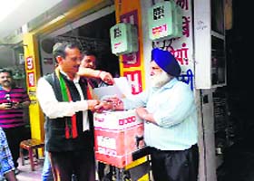 State BJP president Satpal Singh Satti during a shop-to-shop campaign in Una on Wednesday