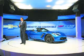 General Motors' president (North America) Mark Reuss poses with a new Chevrolet Corvette at the New York Auto Show in this file photo. The company posted lower quarterly profit on Thursday after a massive recall due to defective ignition switches linked to at least 13 deaths.