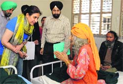 Tarantarn Singh Bindra, CJM-cum-Secretary, and the SMO, Dr Adesh Kang, talk to one of the members of the family at the Civil Hospital in Phase VI, Mohali, on Thursday. Tribune photo: Vicky Gharu